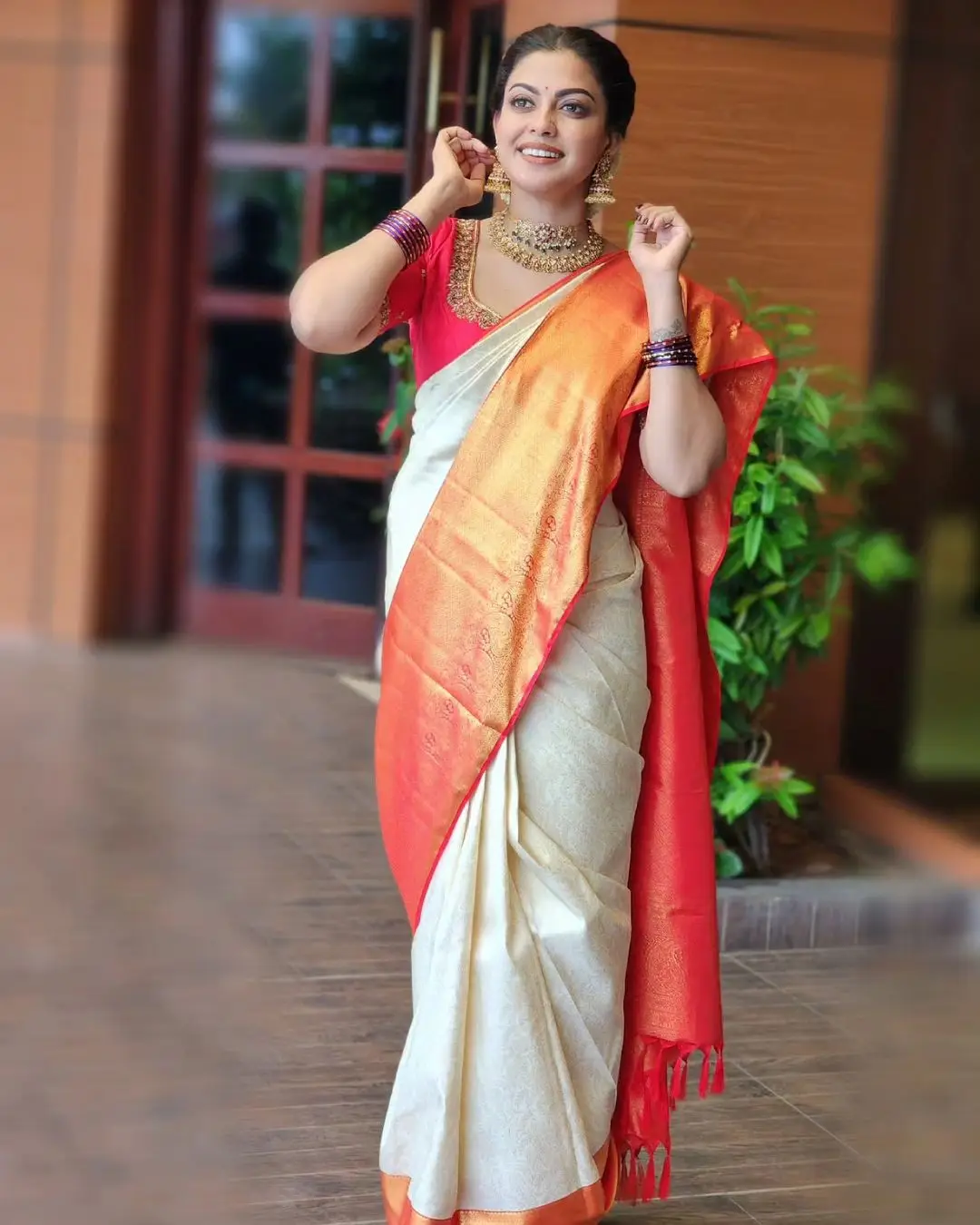 Anusree Nair Wearing Beautiful Earrings Jewellery White Saree Orange Blouse